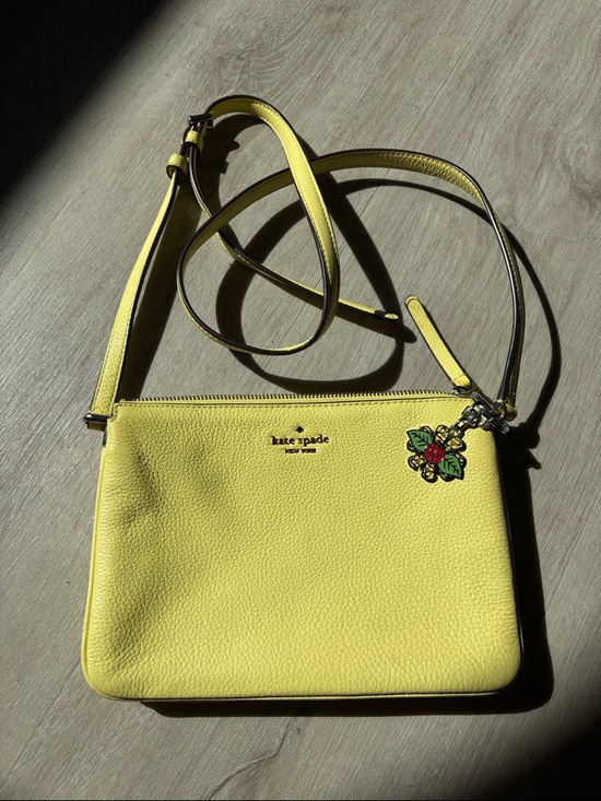 kate spade Handbags - kate spade yellow pebbled leather crossbody with floral charm